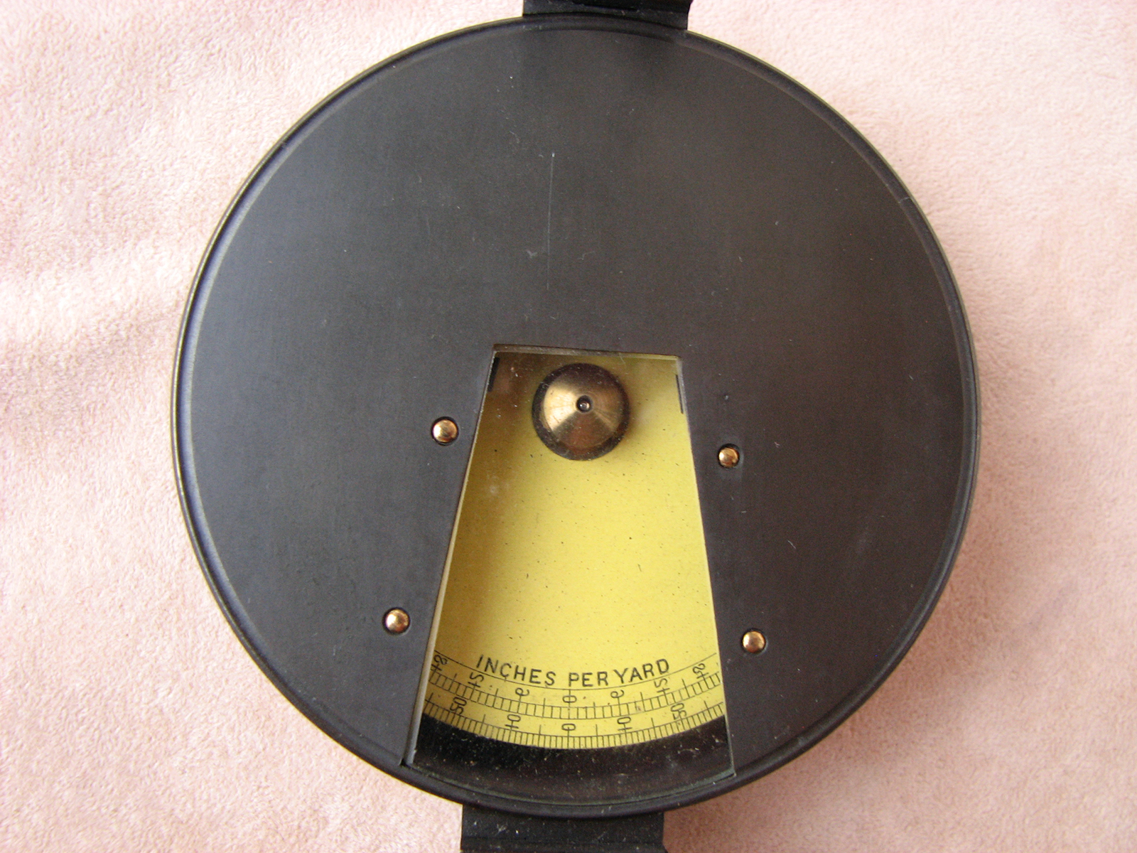 Prismatic inches per yard clinometer in fitted leather case